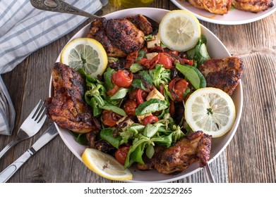 Whole Carved And Oven Baked Chicken With A Delicious Mediterranean Salad. Made With Roasted Vegetables, Olive Oil And Feta Cheese. Healthy Low Carb Or Ketogenic Meal