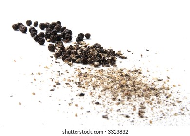 whole, cracked and ground black pepper on white - Powered by Shutterstock