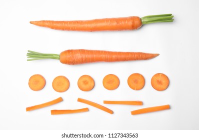 Whole And Cut Fresh Carrots On White Background