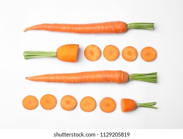 Whole And Cut Fresh Carrots On White Background