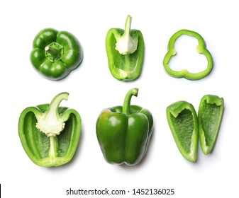 Whole and cut green bell peppers on white background, top view