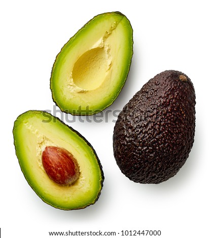 Whole and cut in half avocado isolated on white background. Top view