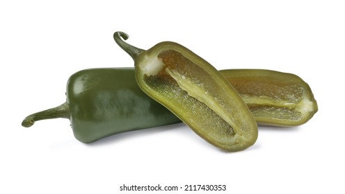 Whole and cut pickled green jalapenos on white background