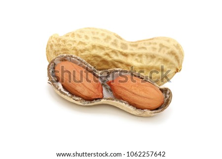 Whole and disclosed peanuts in pods isolated on the white background. Close-up