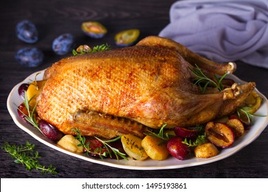 Whole Duck With Potatoes, Plums And Herbs