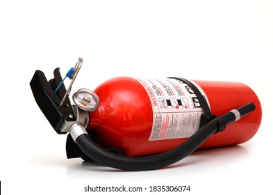 A Whole Fire Extinguisher Home Lay Down On White