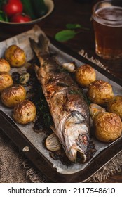 Whole Fish Stuffed with Sorrel and Baked with New Potatoes and Onion