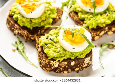 Whole grain bread with avocado and boiled eggs. - Powered by Shutterstock