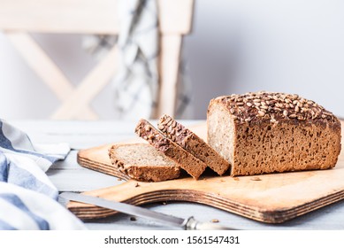 Whole Grain Bread On White, Wooden Table