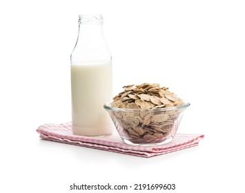 Whole grain cereal flakes and milk. Wholegrain breakfast cereals isolated on a white background.