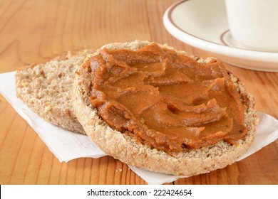 A Whole Grain English Muffin With Pumpkin Butter And A Cup Of Coffee