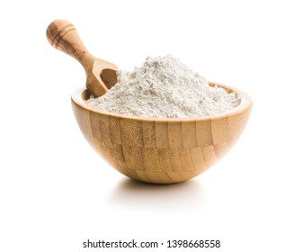 Whole grain wheat flour in bowl isolated on white background. - Shutterstock ID 1398668558