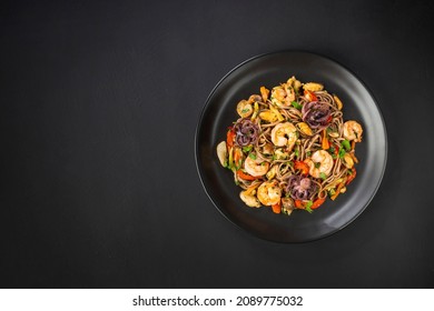 Whole Grains Pasta Spaghetti Seafood Pasta In A Black Plate On Concrete Black Background Copy Space 