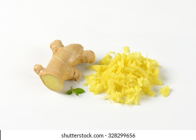 Whole And Grated Fresh Ginger On White Background