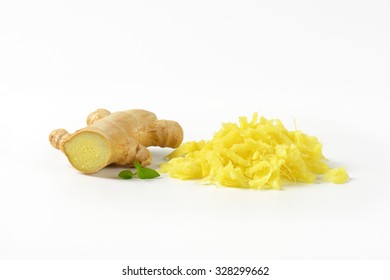 Whole And Grated Fresh Ginger On White Background