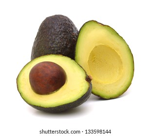 Whole And Half Avocado Isolated On White.