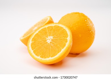 Whole and half cut  orange on white background