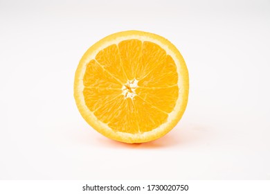 Whole and half cut  orange on white background