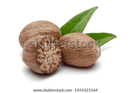 Whole and half nutmeg with leaves isolated on white background Foto stock © 