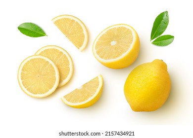 Whole and half sliced lemon with green leaves isolated on white background. Top view. Flat lay.