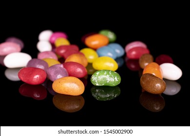 Lot Of Whole Jelly Bean Candy Isolated On Black Glass