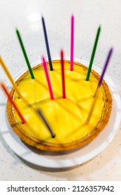 Whole Key Lime Pie Cake With Colorful Multicolored Birthday Candles On Table White Plate With Graham Cracker Crust In Traditional Key West Style With Yellow Color