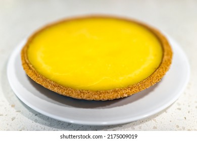 Whole Key Lime Pie Cake On Table White Plate With Graham Cracker Crust In Traditional Key West Style With Yellow Color