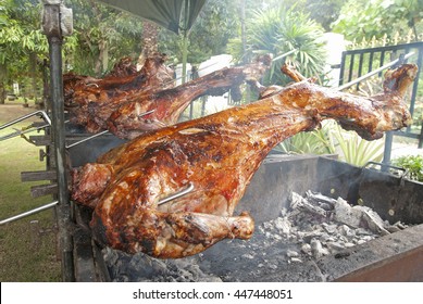 Whole Lamb On Skewer Grilled To Perfection Using Hot Charcoal. Grilled Lamb Is A Favourite Dish Served In Malay Ceremony Such As Weddings Or Baby Fullmoon Ceremony Or Aqiqah.