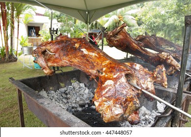 Whole Lamb On Skewer Grilled To Perfection Using Hot Charcoal. Grilled Lamb Is A Favorite Dish Served In Malay Ceremony Such As Weddings Or Baby Fullmoon Ceremony Or Aqiqah.