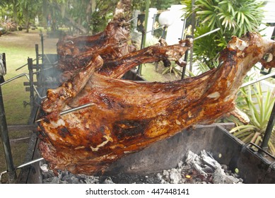 Whole Lamb On Skewer Grilled To Perfection Using Hot Charcoal. Grilled Lamb Is A Favourite Dish Served In Malay Ceremony Such As Weddings Or Baby Fullmoon Ceremony Or Aqiqah.