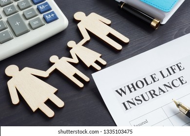 Whole life insurance application form and pen.