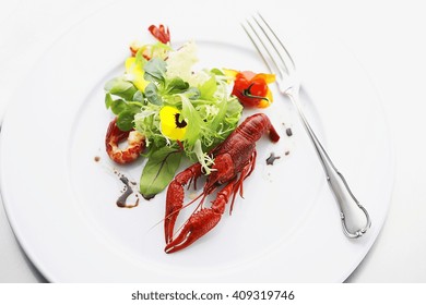 whole lobster with salad at expensive restaurant