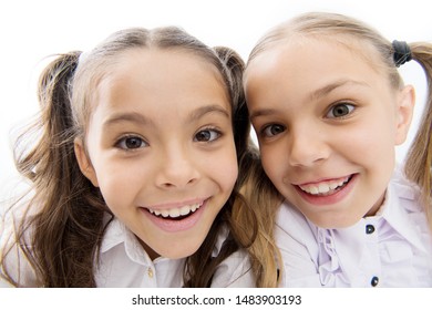 A Whole New Look. Happy School Girls. Adorable Little Girls Smiling Isolated On White. Primary School Girls With Charming Smiles And Long Ponytails. Cute Girls Classmates. Making Selfie.