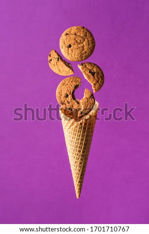 Similar – Ice cream cone with unpeeled peanuts on pink background