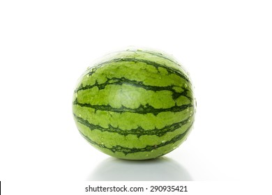 Whole organic mini watermelon on a white background.