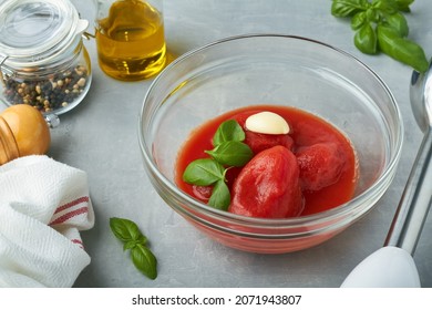 Whole Peeled Tomatoes In A Bowl For Tomato Pizza Sauce Basil Garlic Olive Oil Blender