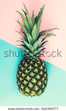 Whole pineapple on a split dutone background