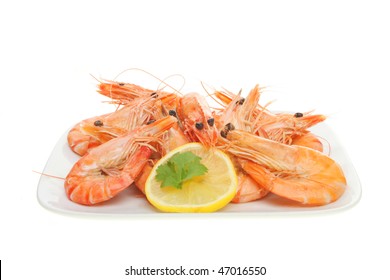 Whole Prawns With A Slice Of Lemon On A Plate