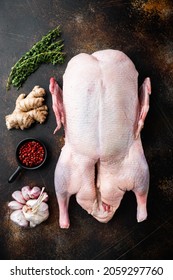 Whole Raw Goose Meat On Old Dark Background, Top View.