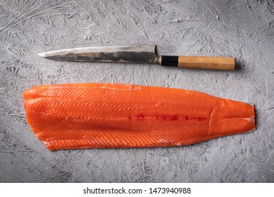 Whole Raw Salmon Fillet With Japanese Sushi Knife