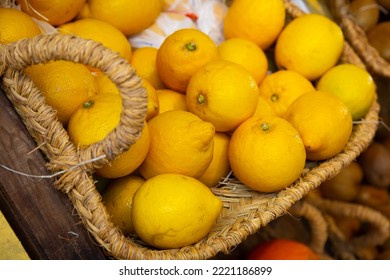 Lot of whole ripe lemons lying in a wicker basket. Vitamin fruits.. - Shutterstock ID 2221186899