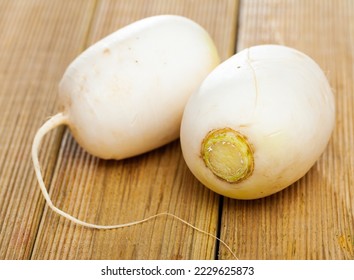 Whole ripe turnip root vegetables on wooden background. Healthy nutrition concept - Shutterstock ID 2229625873