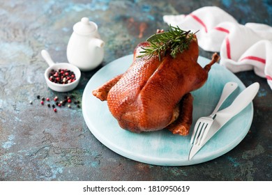 Whole Roast Duck On A Wooden Plate, Selective Focus