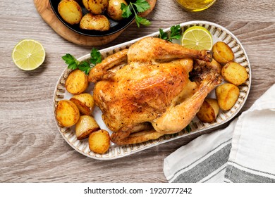 Whole Roasted Chicken With Baked Potatoes.