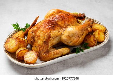 Whole Roasted Chicken With Baked Potatoes.