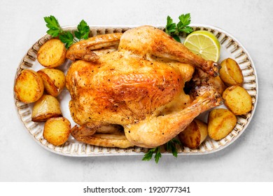 Whole Roasted Chicken With Baked Potatoes.