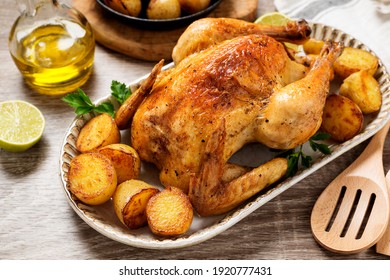 Whole Roasted Chicken With Baked Potatoes.