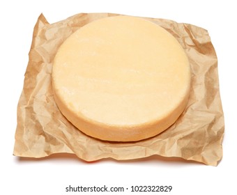 Whole round Head of parmesan or parmigiano hard cheese on white background