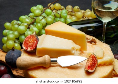 Whole round Head of parmesan or parmigiano hard cheese and wine