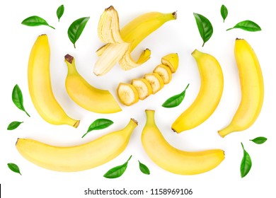 Whole And Sliced Bananas Decorated With Green Leaves Isolated On White Background. Top View. Flat Lay